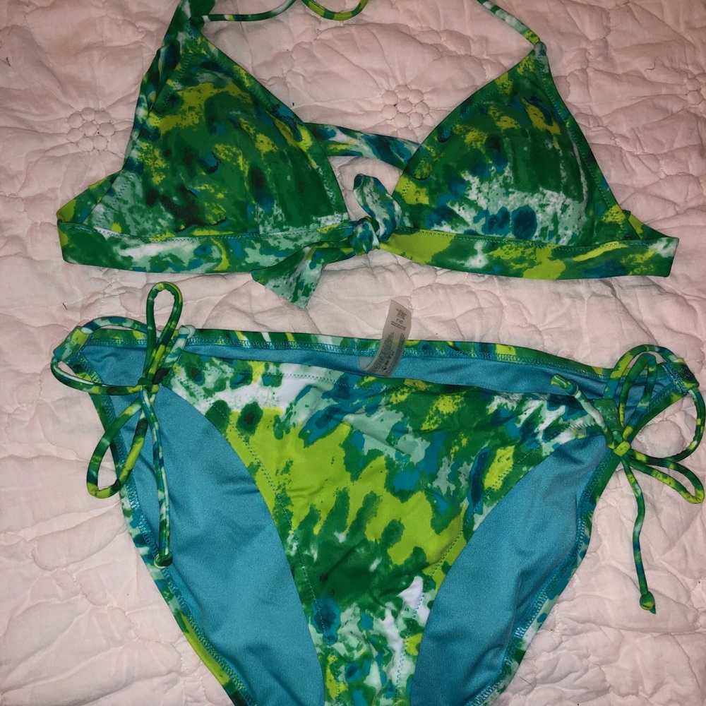 Victoria’s Secret Bikini top is M and bottom is L